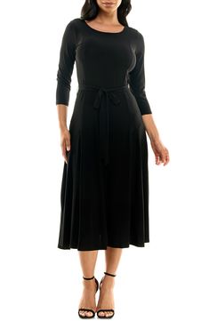 A twirl-worthy, tea-length skirt brings an elegant balance to a solid work-to-weekend dress fashioned from a stretch jersey for a sensible fit. 48" length Bateau neck Three-quarter length sleeves Waist belt 95% polyester, 5% spandex Machine wash, tumble dry Imported Model stats: 5'10" height, 32" bust, 25" waist, 36" hip. Model is wearing size Small. Flattering A-line Midi Dress In Elastane, A-line Elastane Midi Dress, Stretch A-line Midi Dress For Work, Classic Fit And Flare Midi Dress, Flattering Fit A-line Midi Dress In Elastane, Fit And Flare A-line Midi Dress In Elastane, Flattering A-line Midi Dress With Elastane, Black 4-way Stretch Dress, Flattering Black Elastane Midi Dress