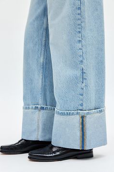 Elevated essential BDG jean featuring a wide cuffed hem. Designed with a mid-rise waist that sits above the hips and a wide-leg silhouette in a classic rigid denim for a tailored look. Exclusively at Urban Outfitters. Features BDG Thea cuffed wide leg jean Cuffed baggy jean Rigid non-stretch denim Mid rise waist that sits above the hips Wide cuffed hems 5-pocket styling Zip fly and button closure Content + Care 100% Cotton Machine wash Imported Size + Fit Mid rise Wide leg Full length Model in D Baggy Jean, Bdg Jeans, 30s Fashion, Fall 24, Cuffed Jeans, Blue Fits, Wide Cuff, Fall Style, Winter 2024