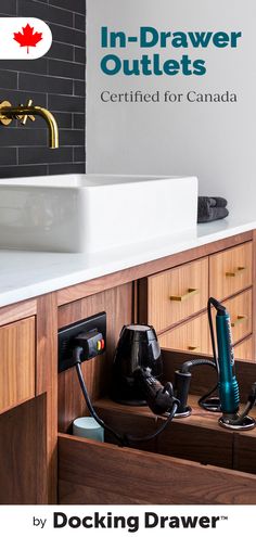 a bathroom with a sink, hair dryer and other items on the counter top