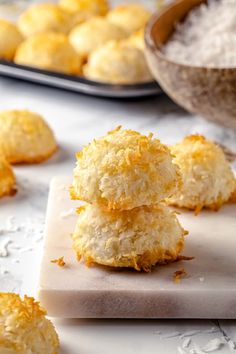 three coconut cookies stacked on top of each other