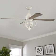 a white ceiling fan with three light bulbs