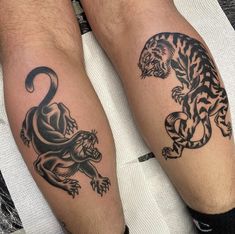 two men with tattoos on their legs, one has a tiger and the other is a leopard