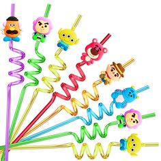 a bunch of different colored plastic toys with faces on them and some straws in the shape of animals