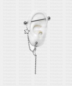 a white ear with chain attached to it and two stars hanging from the end of it