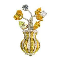 This whimsical floral design pin features natural colorless and fancy colored diamonds set in platinum and 18kt yellow gold. This lovely pin showcases fancy yellow, orange, and gray fancy shape diamonds in a colorless and fancy yellow diamond pave vase. The heart shape diamond is a GIA-certified 0.92ct Natural Fancy Vivid Orange-Yellow. This classic pin from the 20th century is a wonderful addition to any woman's jewelry box. Victor Wallpaper, Colored Diamond Jewelry, Fancy Yellow Diamond, Feather Ring, Floral Brooch, Antique Brooches, Diamond Brooch, Heart Shaped Diamond, Fancy Diamonds