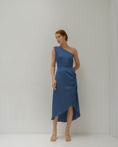 Celeste Slate Blue Satin Midi Dress / One Shoulder Tea Length | Etsy Vietnam Pre-draped Bridesmaid Dress With Asymmetrical Neckline, Pre-draped Ruched Bridesmaid Dress, Chic Bridesmaid Midi Dress With Ruched Back, Pre-draped Sleeveless Midi Dress With Ruched Bodice, Evening Dresses With Folds And Fitted Bodice, Ruched One-shoulder Dress With Asymmetrical Neckline For Dinner, Elegant One Shoulder Dress With Ruched Bodice For Spring, Evening Dresses With Ruched Back And Asymmetrical Neckline, Elegant One-shoulder Dress With Ruched Bodice For Spring