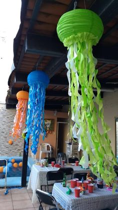 some very pretty jellyfish decorations hanging from the ceiling