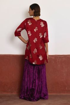 Red short kurta in brocade with floral woven motifs. Comes with purple velvet sharara. - Aza Fashions Red Brocade Sharara With Traditional Drape, Festive Brocade Sharara With Traditional Drape, Festive Brocade Sharara In Traditional Drape, Festive Semi-stitched Brocade Sharara, Festive Traditional Drape Brocade Sharara, Red Brocade Sharara With Zari Work, Transitional Red Sharara With Unstitched Blouse, Red Sharara With Unstitched Blouse For Transitional Season, Brocade Traditional Wear With Gota Work