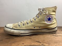 "this old man vintage presents ... oh wow.  amazing pair of chucks from 1970-80s.  pale yellow canvas.  black stripes along the bottom of the foot. classic all-star \"patch\". 8 hole lace ups tagged ... converse Made in USA  All Star measurements ... vintage size: 10 outside length (toe to heel): 12 inches outside ball of foot: 4 inches condition ... a little dingy, especially near the toes. the inside is pretty clean and the soles have lots of life. see pictures for more details. * I know some Vintage Yellow Sneakers For Streetwear, Vintage Yellow High-top Sneakers, Yellow High-top Cotton Sneakers, Yellow Cotton High-top Sneakers, Vintage Canvas Shoes With Rubber Sole For Streetwear, Vintage High-top Cream Sneakers, Vintage Cream High-top Sneakers, Vintage Canvas Sneakers With Vulcanized Sole, Vintage Cream Sneakers With Vulcanized Sole