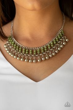 Threaded along dainty silver rods, stacks of green stone beads give way to a row of shiny silver beads, creating an earthy fringe below the collar. Features an adjustable clasp closure.

Sold as one individual necklace. Includes one pair of matching earrings. Short Silver Necklace, Textured Gold Ring, Paparazzi Accessories Jewelry, Coordinates Jewelry, White Pearl Jewelry, Inexpensive Jewelry, Green Stone Necklace, Green Beaded Necklace, Beaded Necklace Designs