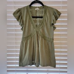 Nwt Self Esteem V-Neck Ruffle Cap-Sleeve Babydoll Shirt Cotton/Polyester Color - Sage Green Size - Xs Green V-neck Top With Ruffles, Casual Cotton Flutter Sleeve Tops, Casual Cotton Tops With Flutter Sleeves, Spring Casual Short Sleeve Top With Cap Sleeves, Cotton Short Sleeve Top With Ruffle Sleeves, Ruffled Cotton Short Sleeve Top, Spring Casual Cap Sleeve Top, Casual Flutter Sleeve Top For Spring, Ruffle Sleeve Cotton Top With Ruffles