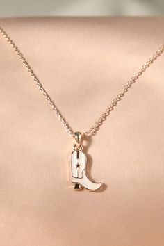 This necklace showcases a miniature cowboy boot pendant, embodying the spirit of the wild west. Crafted with attention to detail, this accessory adds a touch of Western charm to any outfit. Cowgirl Necklaces, Wedding Branding, Camera Icon, The Wild West, Cowboy Boot, Plus Size Shopping, Altar'd State, Dream Jewelry, Wild West