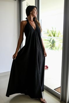 Experience elegance and allure with our Halter Dress Style Backless Maxi. This stunning dress features a captivating V-neckline in the front, complemented by a graceful halter style that accentuates your shoulders and back. The skirt flows beautifully, reaching down to create a long and full silhouette that exudes femininity. Crafted with meticulous attention to detail, this dress comes with a short underdress made of the same fabric, ensuring that you feel confident and comfortable without any unwanted transparencies. The halter straps are designed to be both stylish and supportive, featuring double fabric for added durability. We take pride in using high-quality, eco-friendly materials for our handmade creations. This exquisite dress is exclusively made with a blend of 50% cotton and 50% Elegant Backless Halter Top For Beach Season, Elegant Backless Halter Top For Beach, Summer Wedding Halter Neck Dress, Elegant Halter Neck Top For Beach, Chic V-neck Maxi Dress For Beach Wedding, Elegant Beach Halter Top, Elegant Backless Maxi Dress For Beach Party, Backless Dresses For Beach Party, Elegant Backless Beach Dress For Beach Party