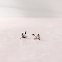 Tiny Stud Earrings: Leaves - Freshie & Zero Studio Shop Minimalist White Gold Sterling Silver Ear Climbers, Silver Nature-inspired Everyday Earrings, Silver Everyday Nature-inspired Earrings, Silver Nature-inspired Earrings For Everyday, Everyday Silver Nature-inspired Earrings, Silver Minimalist Earrings For Her, Minimalist Leaf-shaped Sterling Silver Earrings, Silver Minimalist Earrings As A Gift For Her, Minimalist Leaf-shaped Sterling Silver Jewelry