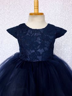 A french laced twist on a classic dress that's perfect for any fancy event or get together! High quality Cord Floral Lace material is used to make the bodice and the cap sleeves. The bodice is fully lined underneath for comfort. Zipper can be found on the back of dress. Dress comes with a French Lace big bow made out of the same material. Three layers of tulle make the bottom half of the dress. The dress is finished off with one layer of lining underneath the tulle and another layer of lining wi Sleeved Wedding, Toddler Flower Girl Dresses, Dress Bow, Tulle Gown, Tulle Wedding, Capped Sleeve Dress, French Lace, Classic Dress, Navy Floral