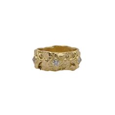 a gold ring with diamonds on it