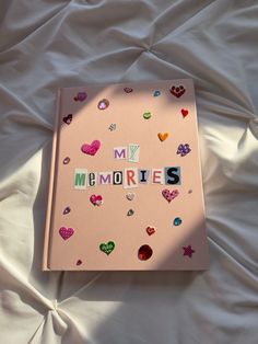 Light pink scrapbook with newspaper lettering spelling My Memories. Decorated with aesthetic heart stickers and jewels. Memories Scrapbook, Scrapbook Cover, Album Journal, My Memories, Cover Journal, Seni Dan Kraf, Summer Scrapbook