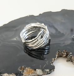 A rustic and organic style ring with ripples all around and jagged edges made from recycled sterling silver. A wide ring of differing widths with little gaps creates a unique and interesting band to wear. It is made by melting silver offcuts into long sections and then forming a band. Each one is individual, not cast. This is a one off. It has been hallmarked by the London Assay Office. Whether you are looking for a new ring for yourself or trying to pick a quirky gift for a loved/friend this pi Melting Silver, Organic Style, Wide Ring, Textured Ring, Wide Rings, Boho Ring, Recycled Silver, Quirky Gifts, Recycled Sterling Silver