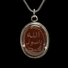 "Islamic Seal Yemeni Aqeeq Pendant. Handmade in 925 sterling silver with agate stone. On the pendant Oval D-Shape red aqeeq - agate stone settled. On the stone written \"Mohammad Rasool Allah\" in Arabic which means \"Mohammad is the messenger of Allah\". Dimensions of stone is 38 mm x 30 mm. Average weight of Islamic Seal Yemeni Aqeeq Pendant is 14 gr. Back side is open and stone touches your skin. Classic and exclusive style. Stone Type: Yemeni Aqeeq - Agate Stone Color: Red Stone Dimensions: Spiritual Agate Jewelry With Polished Finish, Oval Engraved Carnelian Jewelry, Spiritual Silver Agate Gemstones, Silver Carnelian Amulet Jewelry, Traditional Silver Agate Jewelry, Traditional Engraved Agate Jewelry, Rasool Allah, Silver Handmade Jewelry, Magical Fairy