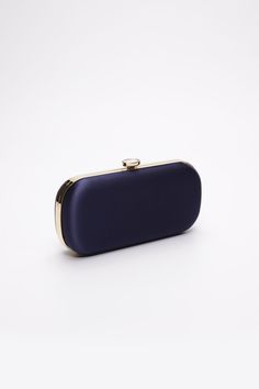 The Navy Bella Clutch is a custom designer clutch, and a timeless choice for an elegant wedding handbag. We’ve found your something blue… Your bridal purse. The Navy Bella Clutch is the perfect option for an evening wedding, as the duchess satin feels luxurious and sensible, without sacrificing style. Perhaps you’re celebrating on the New England coast at a chic hotel or private estate, complete your look with a stylish and elevated custom purse that you’ll love for years to come. The Bella Clut Modern Blue Clutch For Formal Occasions, Blue Formal Bags With Rectangular Case, Luxury Clutch Bags For Formal Occasions, Blue Rectangular Case Bag For Formal Occasions, Formal Blue Rectangular Case Bag, Elegant Blue Rectangular Case Bag, Timeless Gold Formal Bag, Elegant Clutch For Wedding, Elegant Evening Bag For Party