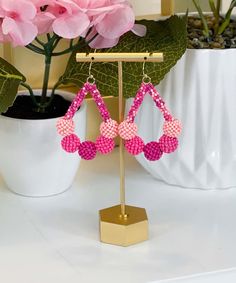 Introducing our enchanting "Just Swing" Earrings in a lovely shade of pink, the perfect accessory to add a touch of whimsy and charm to your ensemble. Crafted with precision, these Seed Bead Ball Teardrop Earrings feature a delightful design that exudes elegance and playfulness.
Measuring 2.5 inches in length, these earrings showcase a graceful teardrop shape adorned with intricate seed bead balls in a beautiful pink hue. The lightweight fish hook design ensures easy and comfortable wear, allowing you to swing and sway with confidence wherever you go.
Whether you're dressing up for a special occasion or adding a pop of color to your everyday look, these "Just Swing" Earrings are sure to turn heads and spark conversation. Let your personality shine as you accessorize with these charming and Pink Teardrop Chandelier Earrings, Pink Chandelier Earrings For Summer Party, Handmade Teardrop Cluster Earrings, Pink Beaded Teardrop Earrings, Pink Teardrop Beaded Earrings For Party, Pink Beaded Crystal Earrings For Party, Pink Teardrop Earrings For Party, Handmade Pink Crystal Drop Earrings, Pink Chandelier Drop Earrings For Gift