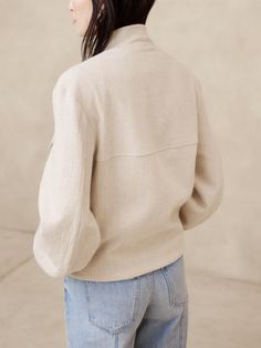 Our take on the uniform trend, we borrowed the utilitarian feel of the classic bomber jacket, paring down the details for a look that reads more 90s minimalism.  For fabric, we selected a luxurious and textured mix of cotton and linen, lightly lined so you can layer through the seasons.  Warmer: Lightly lined so you can layer it through the seasons.  Relaxed fit with wide sleeves.  Bomber collar with zip front closure.  Front and chest pockets.  Internal zip pocket.  Fully lined.  Relaxed fit. 90s Minimalism, Off White Color, The Seasons, Wide Sleeves, Parisian Style, London Fashion Week, Milan Fashion Week, New York Fashion Week, Cotton Linen