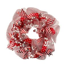 a red and white christmas wreath with candy canes on the front, surrounded by bows