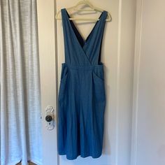 Nwot English Factory Wide-Leg Denim Jumpsuit, Size Medium. This Adorable Overall-Style Jumpsuit Is Perfect For Effortless Style! Made From Breathable Denim, It’s Great For Layering Over A Crop Top Or Tee. Features A Flattering Wide-Leg Fit, Zipper Closure In The Back, And Handy Pockets In The Front And Back. Bohemian, Boho Chic, Casual Style, Effortless Fashion, Vintage Finds, Relaxed Fit, Earthy Tones, Flowy Dresses, Artisan Accessories, Layering Pieces, Chic Outfits, Free-Spirited, Trendy, Fas Spring Denim Bib Front Bottoms, Spring Denim Blue Bib Front Shortalls, Blue Denim Jumpsuit With Bib Front For Spring, Blue Bib Front Denim Jumpsuit For Spring, Summer Workwear Denim Jumpsuit With Bib Front, Non-stretch Blue Denim Jumpsuit With Straight Leg, Spring Indigo Denim Jumpsuit With Pockets, Denim Bib Front Shortalls For Work, Non-stretch Cotton Overalls For Workwear