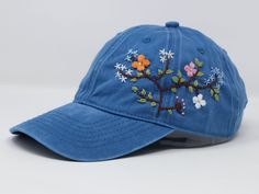 Flower is 100% hand embroidered on a 100% cotton wash baseball cap. Hat is one size fits all with adjustable back strap. Unique cap, one of a kind! I am also open for customization. If you want the item in different colors, please message me, it will take additional 2-3 days of handling time. Free first class shipping, upgradable priority mail service. 30 days return policy, feel confident at your purchase! Embroidery Blue, Wash Baseball Cap, Pretty Hats, Embroidery Caps, Summer Cap, Flower Hat, Simple Embroidery, Flower Hats, Womens Baseball Cap