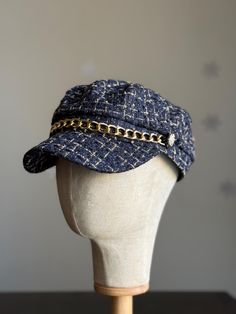 Add a touch of classic charm to your wardrobe with our Women's Cabbie Baker Cap. This timeless accessory combines vintage style with modern flair, perfect for elevating your everyday look. Made from high-quality fabric with a soft, structured fit, this cap offers both comfort and style. Whether you're heading out for a casual day or want to add a chic accent to your outfit, this versatile baker cap is the perfect choice. Dress it up or down for effortless, sophisticated style with a touch of old-school cool! -Material: 35% Cotton, 65% Polyester -Size L, (approx. measurement 23") around the inside of hat -Features a classic sailor look style with nautical buttons and Chain detail decoration -Brim size is 2" Hats For Fall, Baker Hat, Peaky Blinders Hat, Fiddler Cap, Cabbie Hat, Baker Boy Hat, Fisherman's Hat, Newsboy Hat, Baker Boy