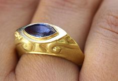 "A unique vintage-style Sapphire marquise signet ring in 14k and 18k yellow, 14k rose gold or 14k white gold. This unique signet-style ring has a magnificent blue Sapphire in a marquise cut, set in a decorated solid gold base. Handmade in Yellow, White, or Rose Gold, this Sapphire ring is eye-catching and stunning. This statement ring is made from high-quality materials that will stand the test of time, making this bold and original piece a part of your wardrobe for years to come. This gemstone Gold Marquise Ring, Marquise Sapphire, Boho Engagement Ring, Beautiful Gold Rings, Unique Gold Rings, Signet Rings Women, Gold Sapphire Ring, Alternative Engagement Ring, Marquise Ring