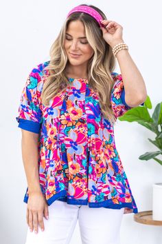 Product Details Colors: Blue, Teal, Orange, Hot Pink, Periwinkle, Purple, Brown Print: Floral Neckline: Round Sleeve: Short Sleeve Hemline: Straight Brand: Umgee Material and Care 100% Rayon Contrast: 100% Cotton Hand Wash Cold Hang/Line Dry Size and Fit Small: Bust 38" Waist 40" Front Length 25" Back Length 27" Medium: Bust 40" Waist 42" Front Length 25.5" Back Length 27.5" Large: Bust 42" Waist 44" Front Length 26" Back Length 28" Photo model is 5'7 and wearing a size small Playful Short Sleeve Blouse, Playful Spring Printed Blouse, Playful Printed Spring Blouse, Playful Printed Blouse For Spring, Playful Printed Multicolor Blouse, Playful Multicolor Printed Blouse, Colorful Pattern Short Sleeve Beach Tops, Colorful Short Sleeve Beach Tops, Blue Cotton Top With Colorful Pattern