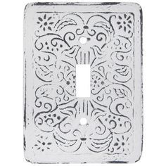 a decorative light switch cover with an intricate design