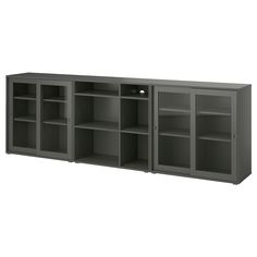 a large gray cabinet with three doors and shelves