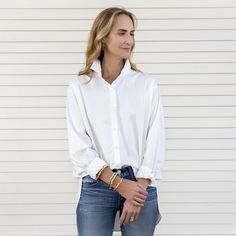 Basic white blouse in the front, not so basic in the back with a adorable embellishment! Pop the collar and have some fun with this oversized shirt. One size fits most (sizes 4-12) Amazing cotton poplin! 97% Cotton 3%Spandex Cool wash, low temp dry, warm iron. Do not iron embellishment. White Shirttail Hem Top For Day Out, Versatile Shirt With Shirttail Hem For Day Out, Chic Everyday Blouse With Rolled Sleeves, Versatile White Shirt For Spring, Versatile White Blouse With Shirttail Hem, Trendy Shirt With Shirttail Hem For Daywear, White Shirt For Fall Day Out, Chic Everyday Blouse With Shirttail Hem, Chic Blouse With Shirttail Hem For Everyday