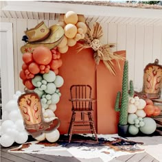 an outdoor display with balloons and decorations