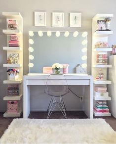 a white desk with a mirror and lights on it