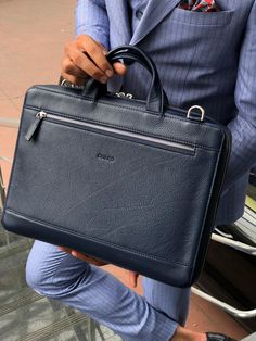 Wales Navy Blue Leather Briefcase is made with 100% leather. This handmade briefcase is especially designed to make you look more stylish and dope. Product: Premium Series Leather Briefcase Color: Navy Blue Width: 35cm Height: 28cm Edge length: 7cm Rear section: 1 back section (A4 size) Key Features: 100% cowhide, unbreakable steel accessories are used in this briefcase and the inner part of briefcase is made with special production lining.  1pcs adjustable Shoulder Strap. Mens Luxury Accessories, Mens Accessories Bracelet, Leather Messenger Bags, Leather Messenger Bag Men, Mens Gadgets, Leather Formal Shoes, Steel Accessories, Leather Ideas, Leather Product