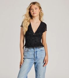 This mesh top features sheer short sleeves, a V-neckline with an adorable center bow detail, and a dainty floral velvet burnout pattern on lined mesh fabric. Perfect for everyday styling with jeans.Fit & FeaturesStretchy sheer mesh fabric with floral velvet burnout pattern, knit liningSheer short sleevesV-necklineCenter bow detailFitted mid-length hemRuns true to size Trendy V-neck Mesh Top For Summer, Chic V-neck Mesh Top For Summer, V-neck Mesh Top For Summer Parties, Fitted V-neck Sheer Mesh Top, Fitted V-neck Mesh Top For Summer, Summer Mesh V-neck Top, Elegant Sheer Short Sleeve Mesh Top, Sheer V-neck Mesh Top For Spring, Summer Lace Top In Mesh