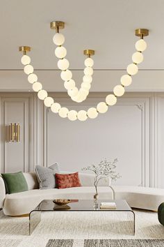 a living room with white couches and round lights