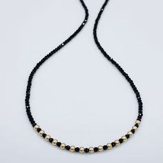 Natural gemstone dainty black Spinel and 14k gold filled choker necklace is approximately 15” plus a 3” 14k gold filled extender chain and lobster claw clasp. Sparkly black spinel and 14k gold filled satin beads. Black spinel looks like black diamonds. You will love this elegant choker/ necklace. Click here to see a longer and chunkier version of this necklace.The 14k gold filled chains and clasps in our shop are sourced from highly reputable U.S.A. vendors and have over 100 times more 14k gold Minimalist Black Jewelry With Gold Beads, Yellow Gold Necklace With Black Beads As Gift, Minimalist Gold Necklace With Black Beads, Minimalist Gold Beaded Necklace With Black Beads, Yellow Gold Necklace With Black Beads For Gift, Black Adjustable Necklaces With Delicate Chain, Dainty Gold Necklace With Black Beads, Minimalist Black Spinel Necklace As Gift, Adjustable Black Necklace With Gold Beads