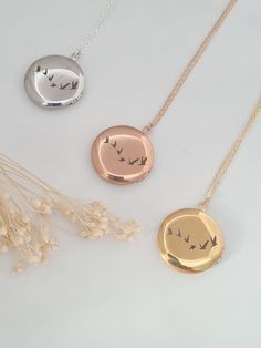 Antique and vintage inspired silver, gold or rose gold plated round floral embossed locket engraved with flying birds on the back of the locket.   Pictures can be added to both sides - see video tutorial https://www.wikihow.com/Put-a-Picture-in-a-Locket    Lovely bridesmaid gift, perfect for a keepsake gift. Simple and elegant. Locket measures 25mm and hangs on a fine silver, gold or rose gold plated chain. Necklaces will arrive in a bag ready for giving. Rose Gold Locket Necklace With Round Pendant, Rose Gold Round Locket Necklace, Nature-inspired Round Pendant Necklace For Wedding, Silver Locket Necklace With Birth Flower Round Pendant, Gold Round Charm Necklace With Pressed Flowers, Gold Charm Necklace With Pressed Flowers, Gold Charm Necklaces With Pressed Flowers, Gold Round Charm Necklaces With Pressed Flowers, Rose Gold Necklace With Pressed Flowers