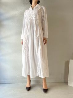 - Vintage April Cornell long sleeve maxi dress - 100% cotton - Shell buttons of the front - Made in India - Tagged S  Bust: 22" Length: 49" We are not responsible for lost, stolen, or damaged packages once they have been shipped. Any additional customs duties or taxes incurred on international orders are the responsibility of the buyer. Please note that our items are vintage and may have minor flaws or imperfections due to their age, which adds to their unique character. Flowy Cotton Maxi Dress For Fall, White Relaxed Fit Maxi Dress For Loungewear, Oversized Maxi Dress For Daywear, Relaxed Fit Long Sleeve Maxi Dress For Daywear, White Relaxed Fit Maxi Dress With Long Sleeves, Flowy Long Cotton Maxi Dress, Relaxed Fit Cotton Maxi Dress For Daywear, Beach Modest Long Sleeve Maxi Dress, Modest Long Sleeve Long Dress For Spring