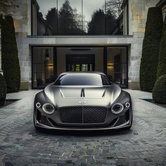 a black car parked in front of a building