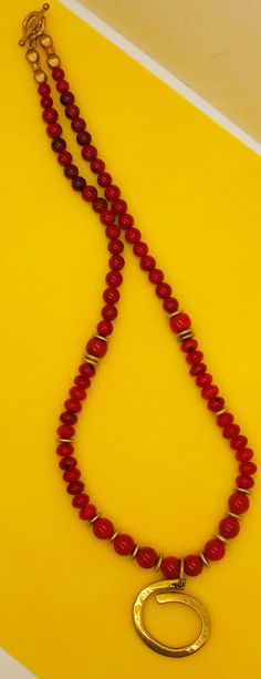 Beautiful Large 10-12 mm Red Coral Beads with Boho Brass Pendant. Matte Brass Accents throughout the necklace accentuate the Pendant nicely. Red 8mm Beads Jewelry For Meditation, Bohemian Single Strand Round Beads, Traditional Red Round Pendant Jewelry, Red Coral Single Strand Round Necklace, Bohemian Necklace With 8mm Round Beads, Red Bohemian Jewelry With 8mm Beads, Round Single Strand Red Coral Necklace, Red Coral Jewelry With 8mm Beads, Round Red Coral Single Strand Necklace