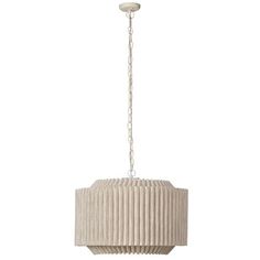 a white chandelier hanging from the ceiling with pleated fabric shades on it