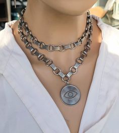 This handmade chunky stainless steel chain layered necklace set with spike is a stunning piece of jewelry that is perfect for those who love bold and edgy accessories. This is one necklace that is adjustable with a built-in extender from approximately 15" to 18",  All the chains of the necklace are made of sturdy stainless steel, making it completely hypoallergenic, waterproof, and non tarnish. It will look exactly like this forever!  This necklace set is an excellent handmade gift for someone s Statement Aesthetic, Chainmail Choker, Chain Layered Necklace, Edgy Accessories, Choker Collar Necklace, Bold Necklace, Aesthetic Jewelry, Layered Necklace Set, Choker Collar