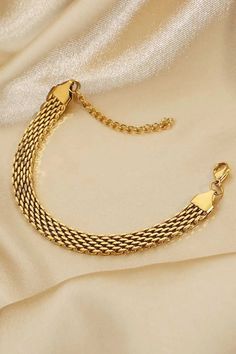 18K Gold-Plated Wide Chain Bracelet Embrace the allure of timeless elegance with our 18K Gold-Plated Wide Chain Bracelet. This stunning piece is designed to elevate any outfit, adding a touch of sophistication to your look. Perfect for both everyday wear and special occasions, it is a versatile addition to your jewelry collection. Key Features Material: Premium 18K gold-plated stainless steel ensures durability and a luxurious shine. Adjustable Fit: The bracelet features an adjustable chain leng Elegant Metal Gold Bracelet With Box Chain, Elegant Gold Box Chain Bracelet, Luxury Gold-tone Jubilee Chain Bracelet, Elegant Gold Bracelet With Box Chain, Elegant Gold-tone Box Chain Bracelet, Luxury Gold Plated Box Chain Bracelet, Luxury Gold-plated Box Chain Bracelet, Elegant Gold Plated Box Chain Bracelet, Elegant Gold-plated Box Chain Bracelet