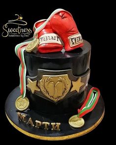 there is a cake with boxing gear on it