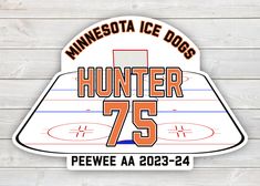 the minnesota ice dogs sticker is shown on a wooden background with text hunter 75